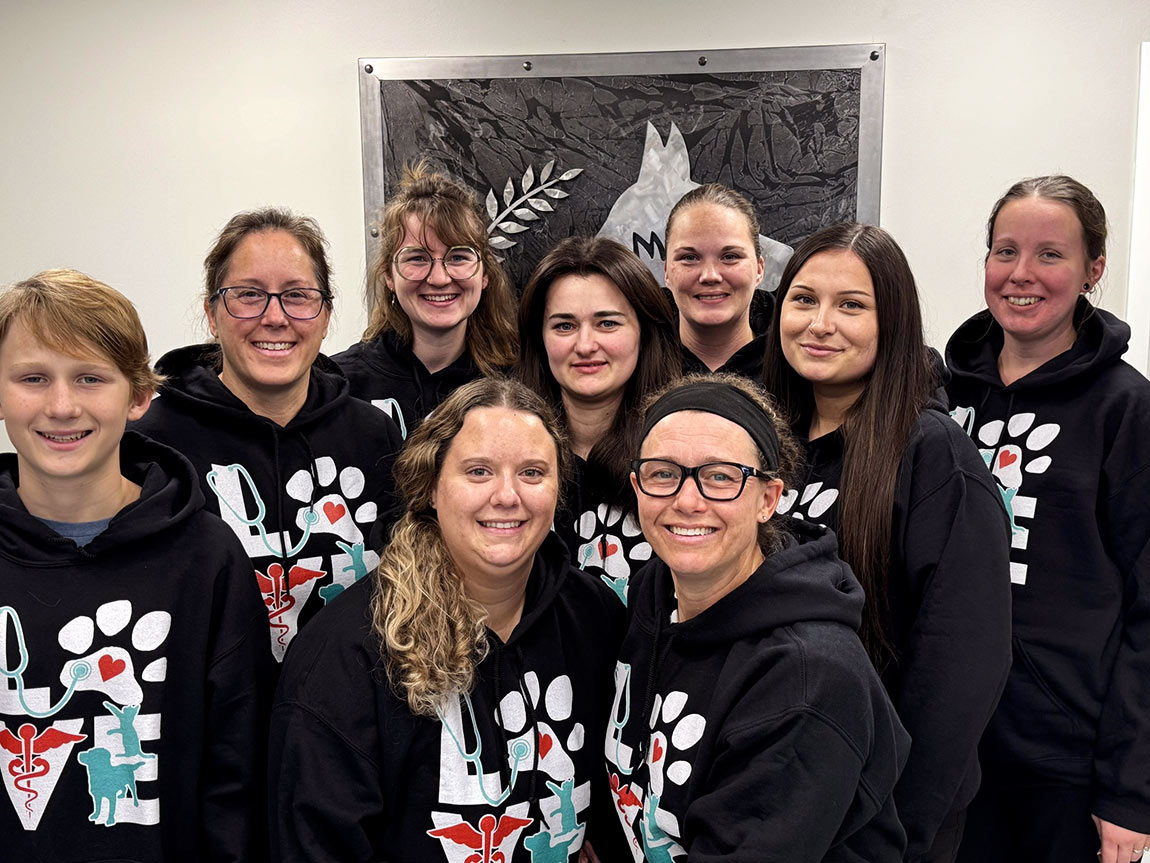 smiling team members at Stonewall Veterinary Hospital